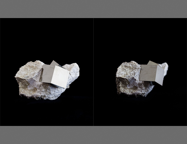 Twinned cubic pyrite specimen in limestone matrix. Spain 
